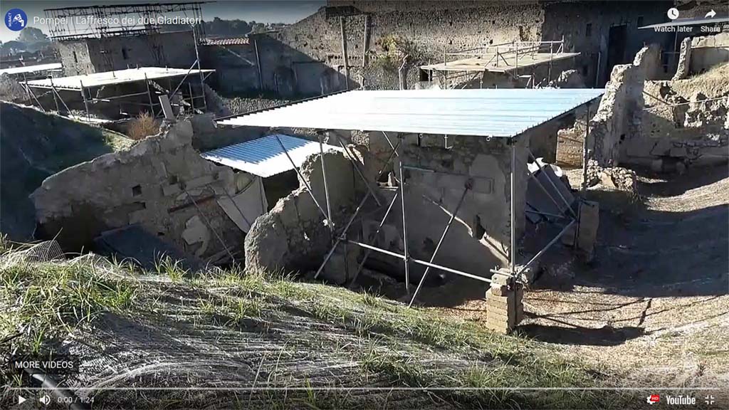 Area behind the widening of the intersection of the Vicolo dei Balconi and the Vicolo delle Nozze D’Argento.
The bar is centre front in this photo which would appear to locate it in the as yet unnamed insula behind V.3 (=V.8?). 
See MiBAC video of Gladiatori Combattenti on YouTube: https://youtu.be/sqq__TTvu5g
Photograph and video courtesy of MiBAC. Use subject to Creative Commons - Attribuzione - versione 3.0.
See commentary by Minister Dario Franceschini on YouTube: https://youtu.be/NvmRXTWRuYw
